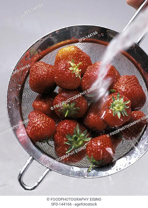 Washing Strawberries in a Colander