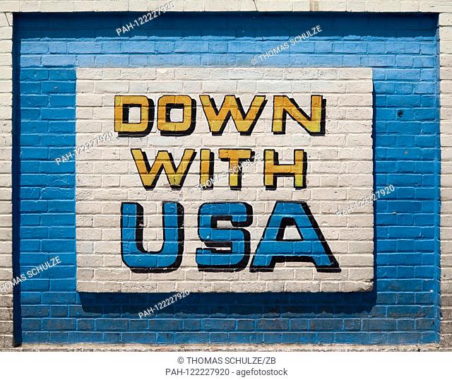 16.04.2017, Iran, Tehran: An anti-America mural ""Down with USA"" on the outer wall of the former US Embassy in the center of the Iranian capital Tehran
