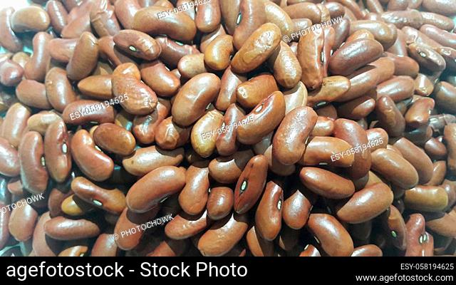 Kidenry beans: Closeup view of uncooked red kidney beans. Dark red useful beans background
