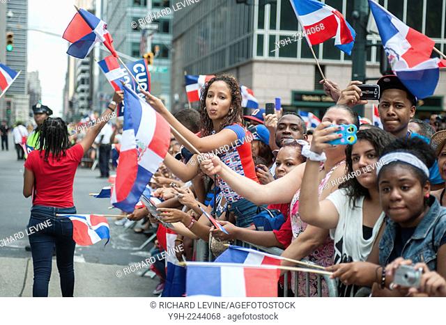 Thousands of Dominican-Americans and their friends and supporters march and view the 33rd Annual Dominican Day Parade in New York on Sixth Avenue
