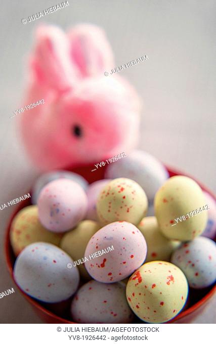 Pink bunny with colorful easter eggs