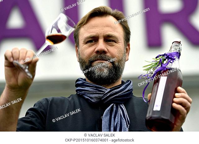 Wine grower Petr Marcincak starts the process of lavender wine pressing in Novosedly, Czech Republic, October 16, 2015. Lavender wine has a light violet colour...