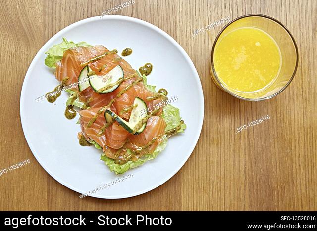 Cured salmon, cucumber and lettuce with an orange juice