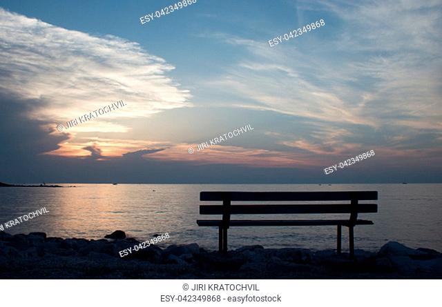 Bench by the sea at sunset in Croatia - Umag