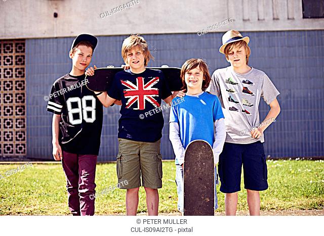 Portrait of boys with skateboards