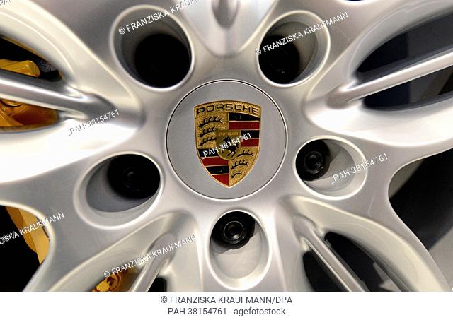 The emblem of the sports car builder Porsche is pictured on the wheel of a Porsche 911 Carrera 4S at the balance sheet press conference at the Porsche Museum in...