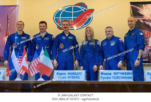 Expedition 34 prime crew members from left: Flight Engineer Tom Marshburn of NASA, Soyuz Commander Roman Romanenko, Flight Engineer Chris Hadfield of the...