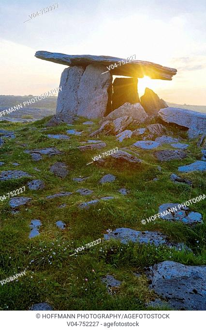 Poulnabrone Megalithic Tomb with rising sun in the Burren, Ireland, Europe