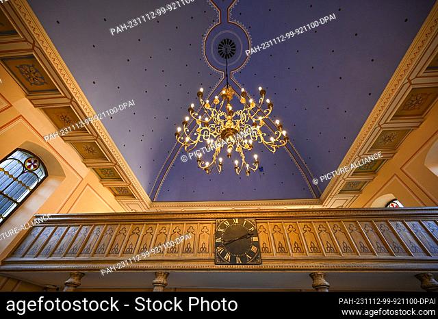 12 November 2023, Saxony-Anhalt, Gröbzig: A chandelier hangs from the blue ceiling in the Gröbzig synagogue. The Gröbzig Synagogue Museum has celebrated its...