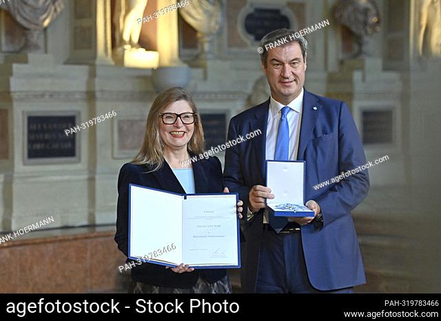 dr Edith WOELFL receives the Bavarian Order of Merit from Markus SOEDER (Prime Minister of Bavaria and CSU Chairman). Awarding of the Bavarian Order of Merit in...