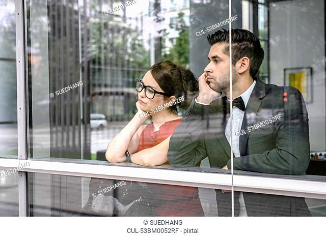 Couple looking out window