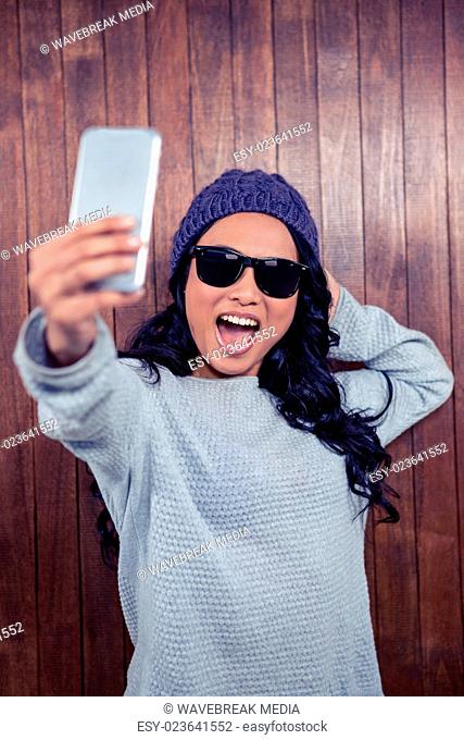 Asian woman taking selfie