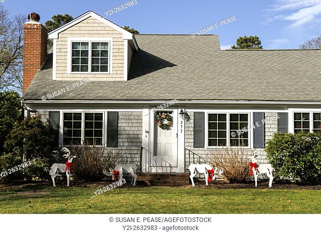 Wooden reindeer on the lawn of a home in South Yarmouth, Cape Cod, Massachusetts, United States, North America. Editorial use only