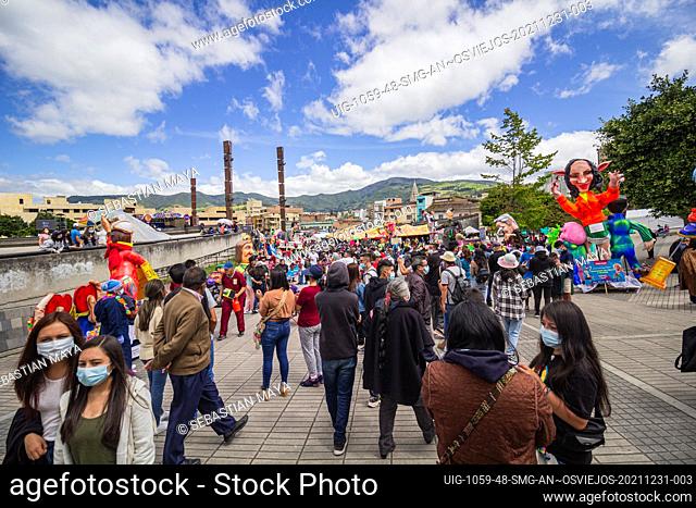 Houndreds of people walk through the city buying burning dolls for the 2022 new year's eve celebrations in Pasto, Nariño - Colombia Every year