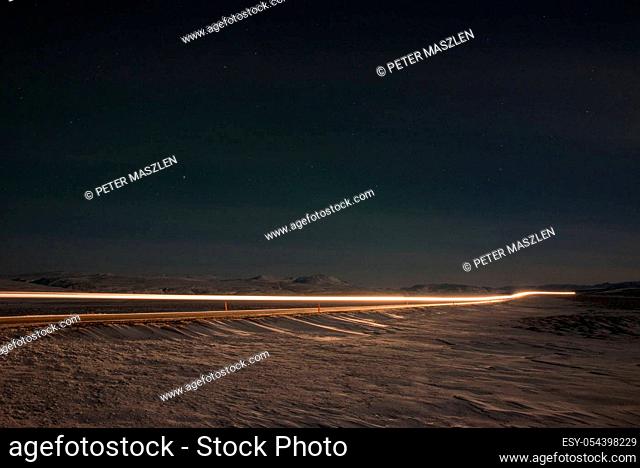 Long exposure of car lights in the night on the Iceland island