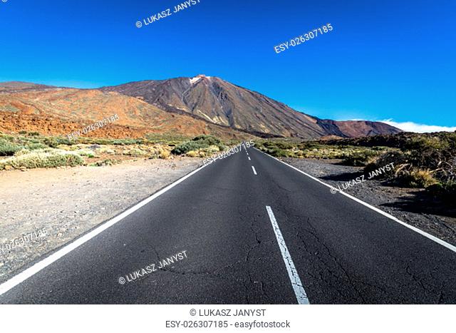 lonely desert road landscape in volcan teide national park, tenerife, canary island, spain
