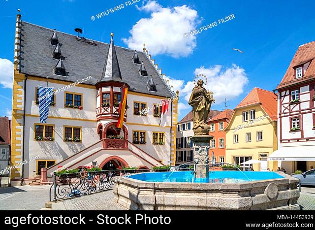 The historic old town of Volkach on the Main in Lower Franconia with town hall and fountain on the market square