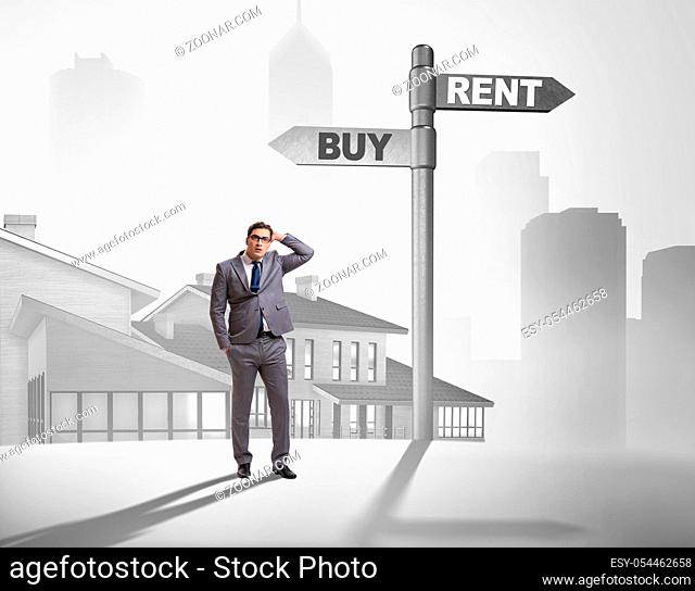 The businessman at crossroads betweem buying and renting