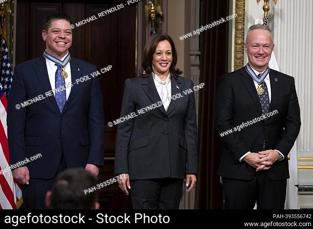 United States Vice President Kamala Harris (C) awards the Congressional Space Medal of Honor to two former NASA astronauts