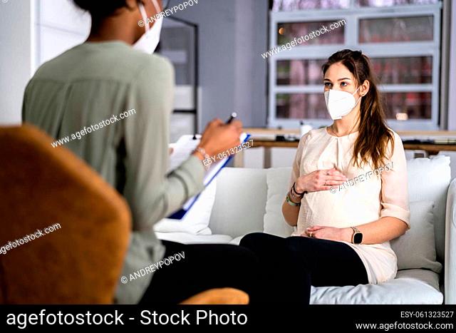 Doula Care And Pregnant Woman Patient At Home