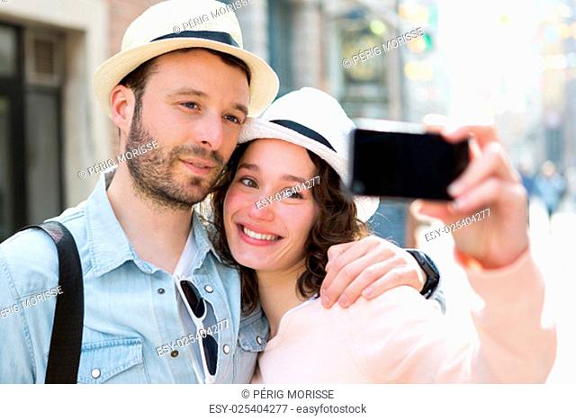 View of a Young couple on holidays taking selfie