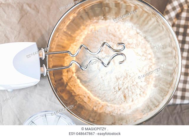 Bake bread with flour, water and the dough hook of a hand mixer