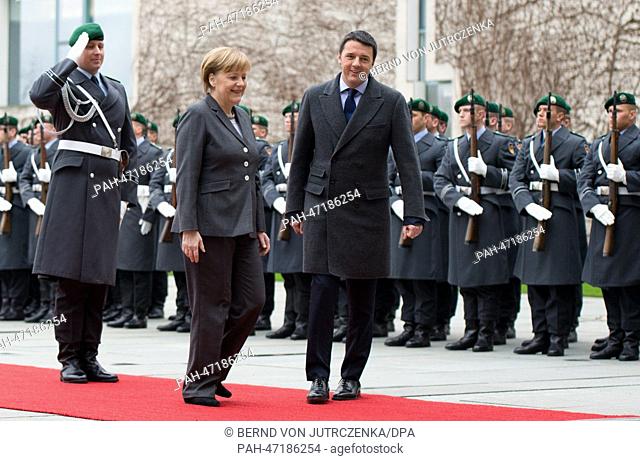 New Italian Prime Minister Matteo Renzi (R) is welcomed with military honors by German Chancellor Angela Merkel (CDU) during his first official visit in front...