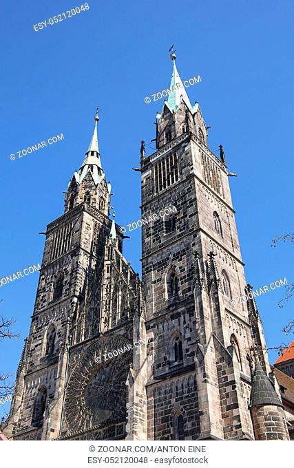 Saint Lawrence cathedral (St. Lorenz) over clear blue sky, medieval gothic church in Nuremberg, Germany, low angle view