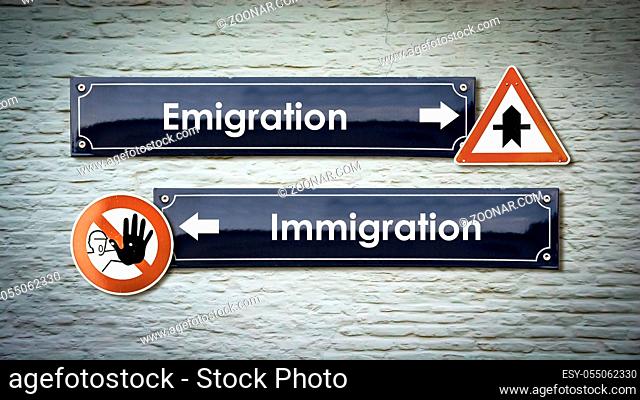 Street Sign the Direction Way to Emigration versus Immigration