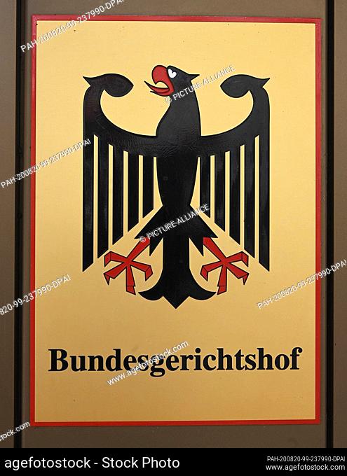 20 August 2020, Baden-Wuerttemberg, Karlsruhe: A signpost with federal eagle and lettering Bundesgerichtshof (Federal Court of Justice)
