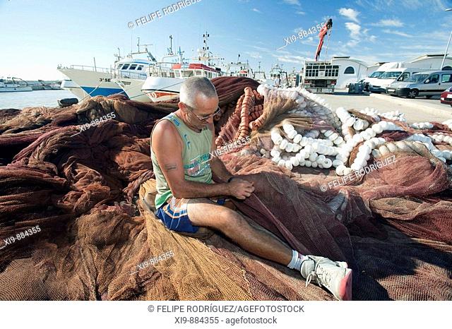 Fisherman fixing the nets. Bonanza port, town of Sanlucar de Barrameda, province of Cadiz, Andalusia, Spain