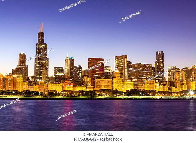 Chicago skyline and Lake Michigan at dusk with the Willis Tower, formerly the Sears Tower, on the left, Chicago, Illinois, United States of America