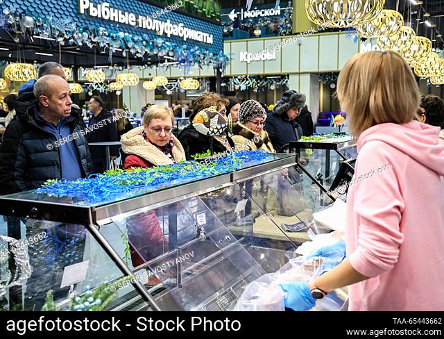 RUSSIA, MOSCOW - DECEMBER 3, 2023: Shoppers are seen at the counter at ""Moskva - Na Volne"", a newly opened fish market at the Gorod Kosino Shopping Centre