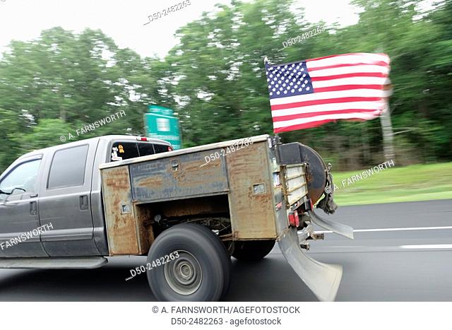 Truck with US flag on Mass Pike, Boston, Massachusetts, USA