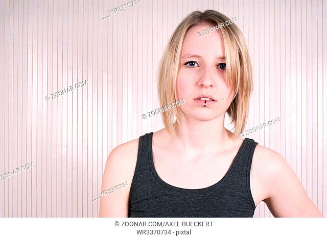 indoor portrait of a young woman from Germany with blond hair and blue eyes