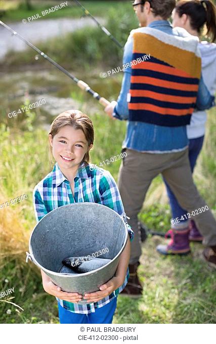 Girl showing off fishing catch