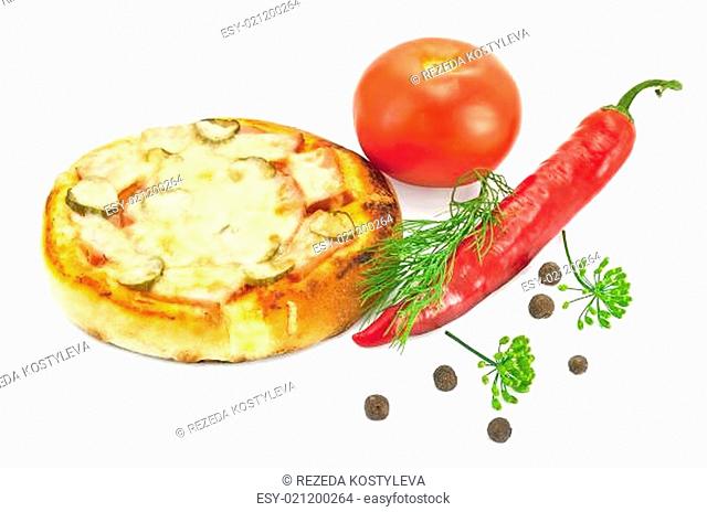 A small pizza with red tomatoes, peppers, dill and a few peas sweet peppers isolated on a white background