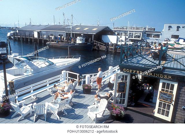Newport, Rhode Island, People relaxing on the deck of The Coffee Grinder coffee shop at Bowen's Wharf in Newport, Rhode Island