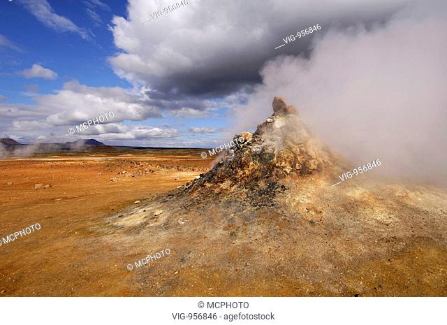 Close-up of steaming vent or fumarole in a geothermal landscape with a view of distant hills at Hverarond near Myvatn, north Iceland - --, --, --, 12/07/2007