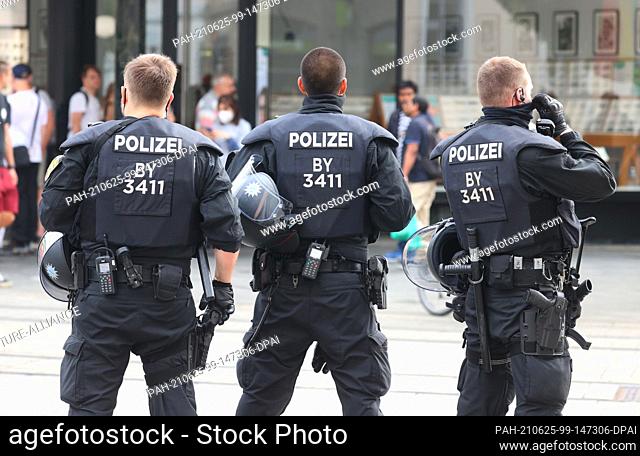 25 June 2021, Bavaria, Würzburg: Police officers stand in the city center. Several people were killed in a knife attack in downtown Würzburg on Friday