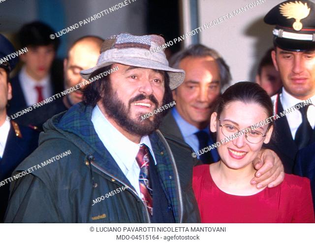 Italian tenor Luciano Pavarotti with his partner Nicoletta Mantovani. 1990s