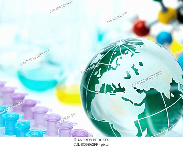 Globe with test tube holder, flasks and molecular model