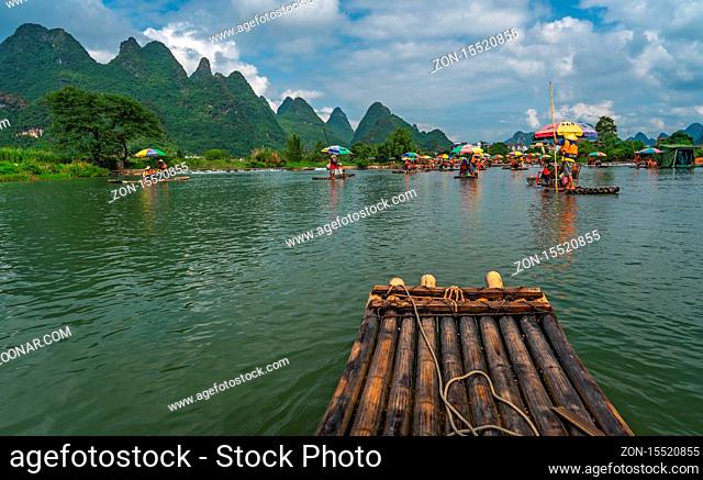 Yangshuo, China - August 2019 : Close up of bamboo raft for carrying tourists steered by guides on scenic and beautiful Yulong River