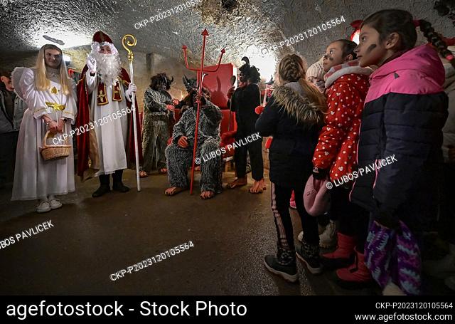 Angels, st. Nicholas and Devil in the underground catacombs which turned into the hell for adults as well for kids in Jihlava, Czech Republic, on December 1