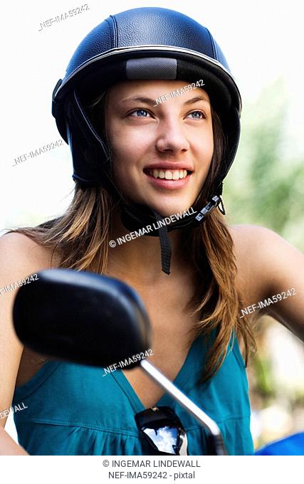 A Scandinavian teenage girl on a vespa Thailand