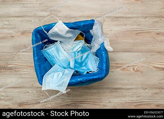 Used and contaminated surgical masks in the waste bin