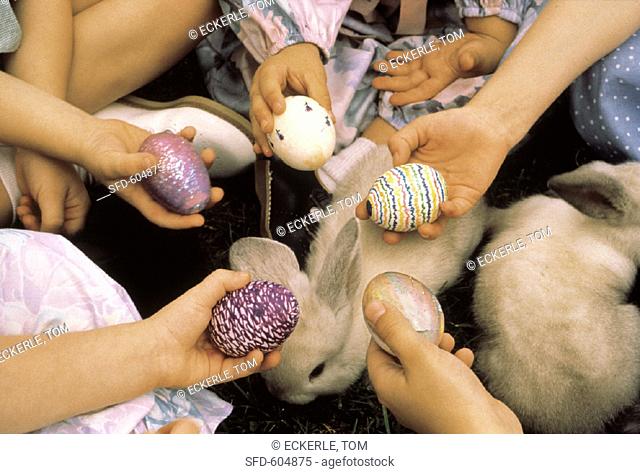 Children Holding Colorful Easter Eggs
