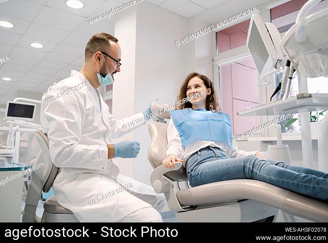 Young woman getting dental treatment in clinic