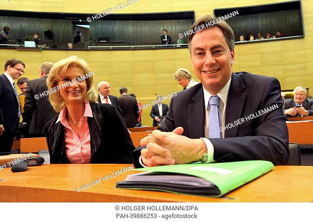 David McAllister (L) attends a meeting of the Lower Saxon state parliament next to CDU member Editha Lorberg in Hanover, Germany, 30 May 2013