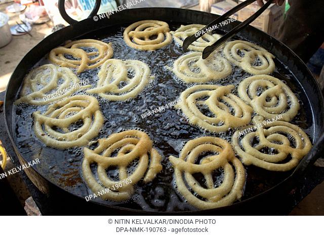 Jalebi frying in wok Surajkund mela Faridabad Haryana India Asia
